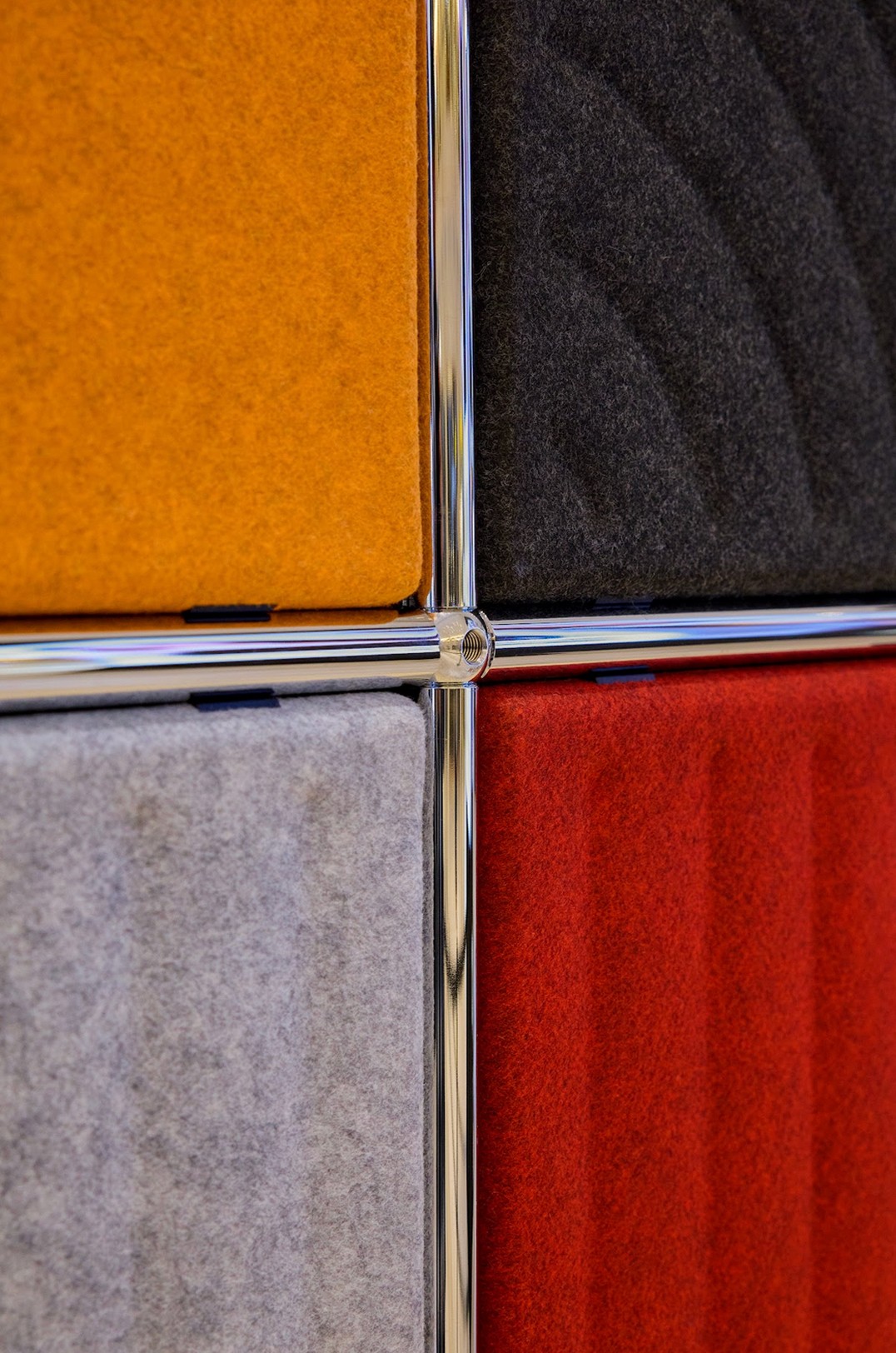 Graphic of a typography specimen showing the alphabet and numerals on top of a dark gray background.