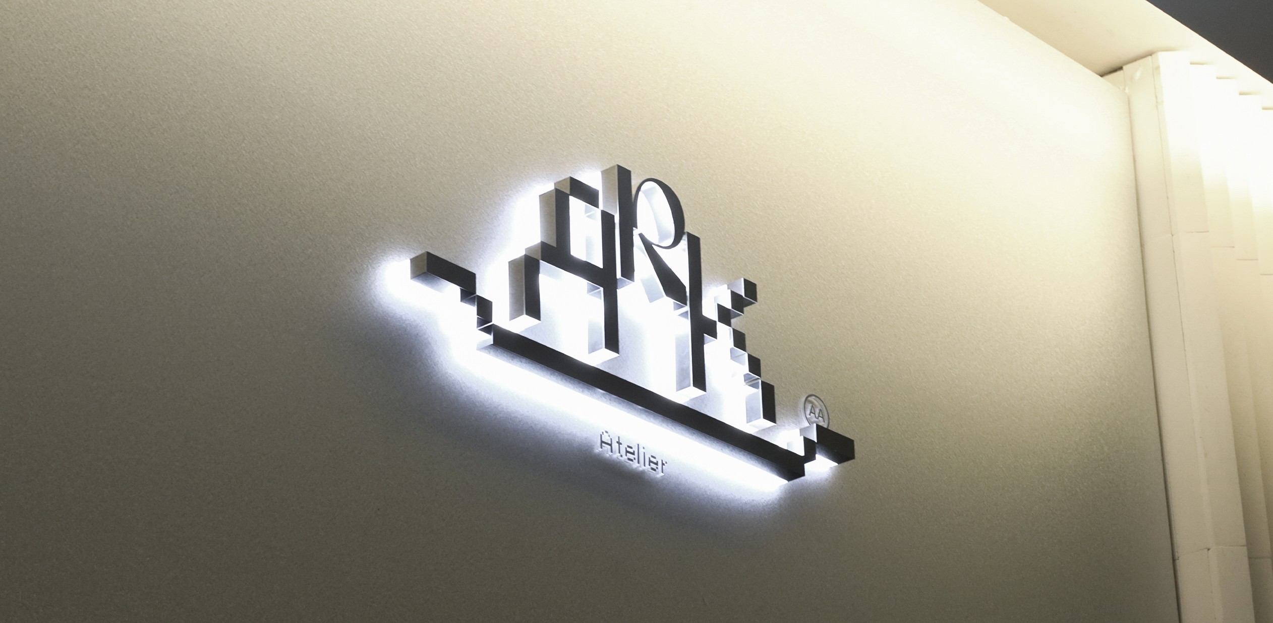 Anders brand wordmark in white placed on top of an image of a modern interior design.