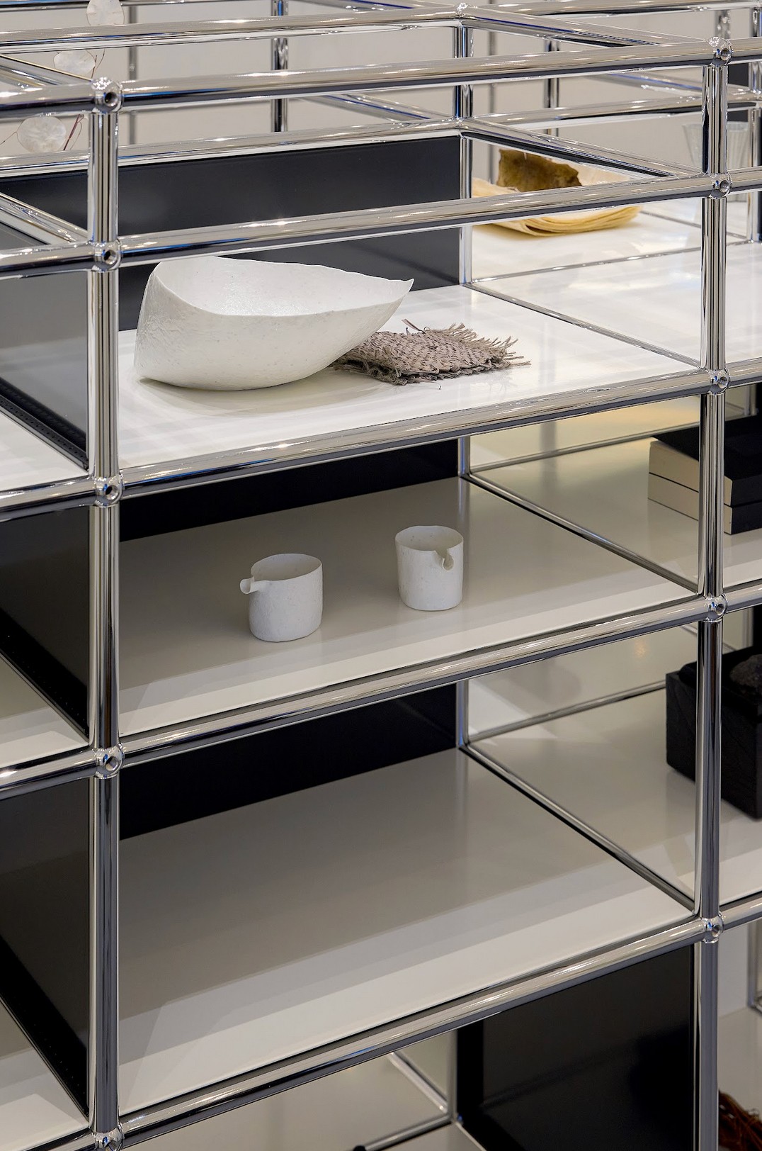 Graphic of a typography specimen showing the alphabet and numerals on top of a dark gray background.