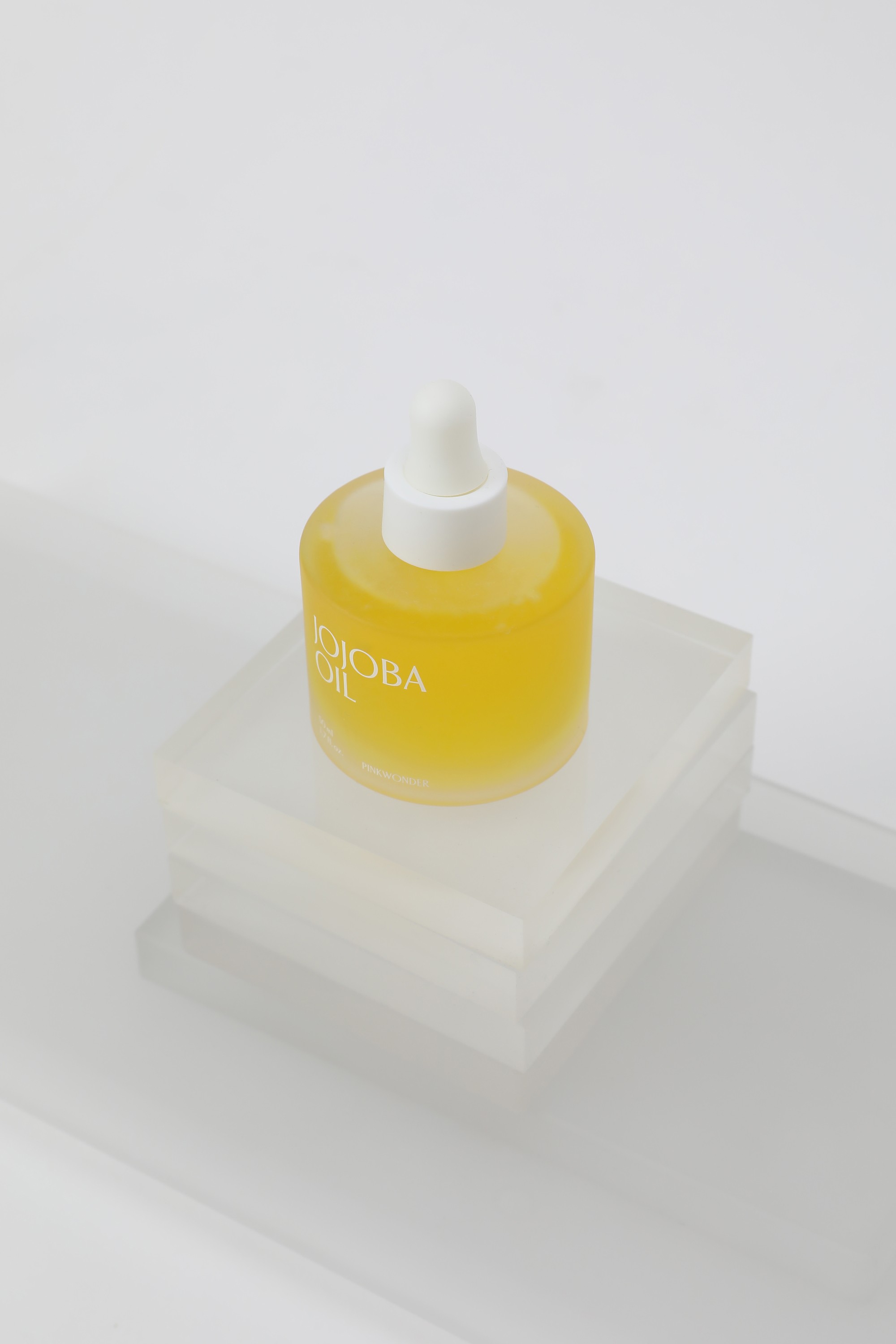 Graphic of a typography specimen showing the alphabet and numerals on top of a dark gray background.